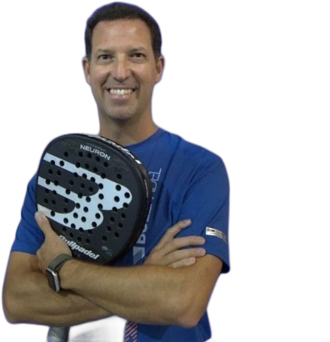 Carlos Ferretti holding a padel racket
