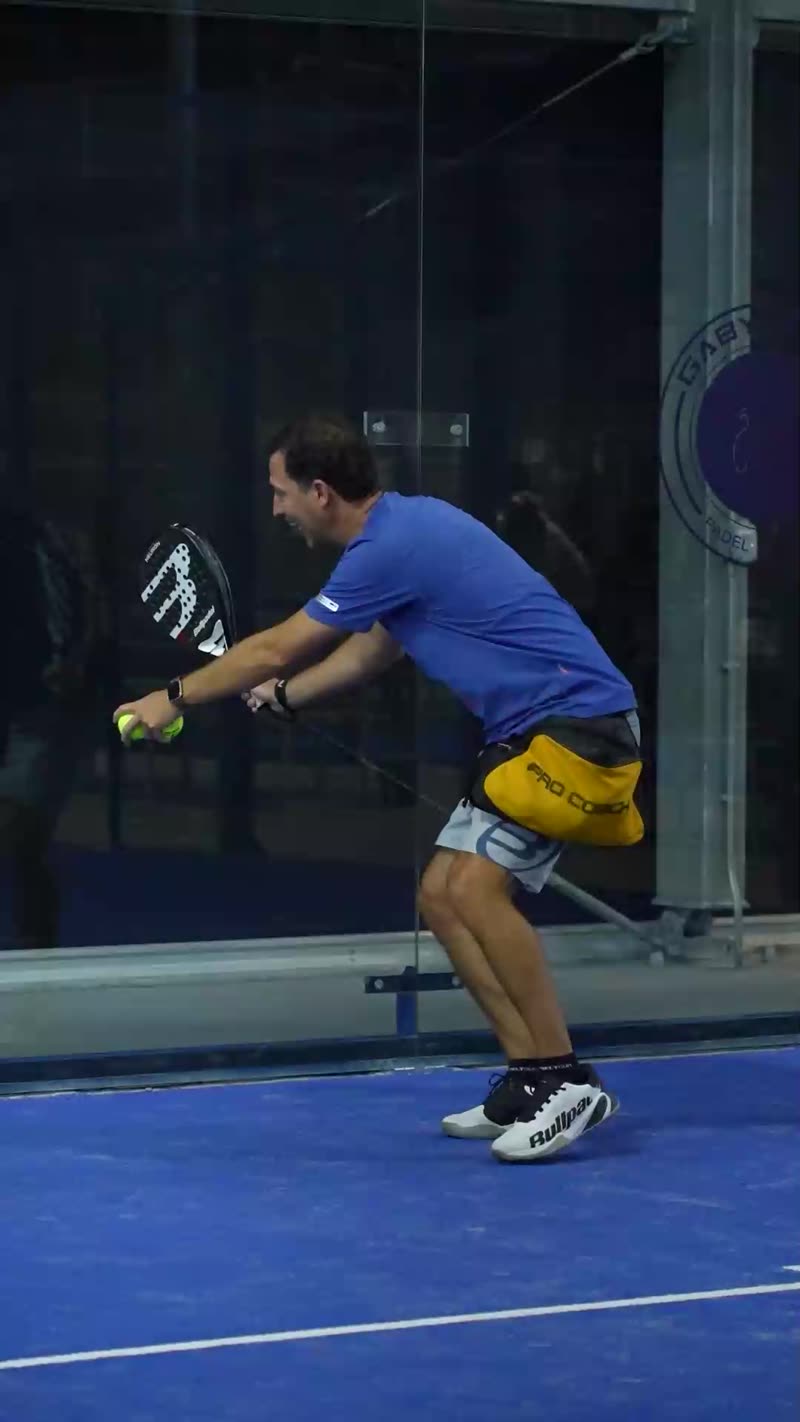 Carlos Ferretti feeding a padel drill