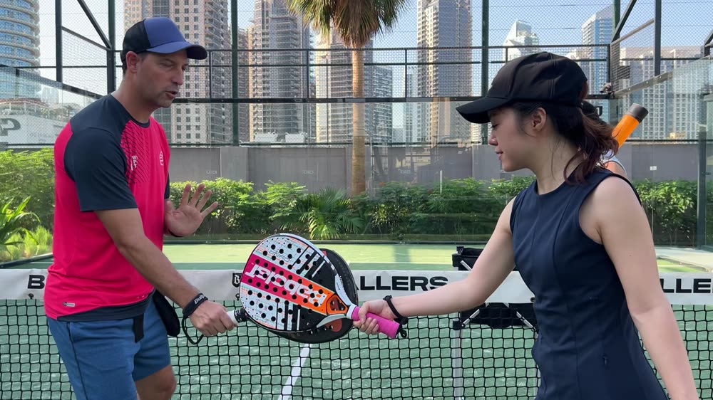 Carlos Ferretti correcting a student's grip