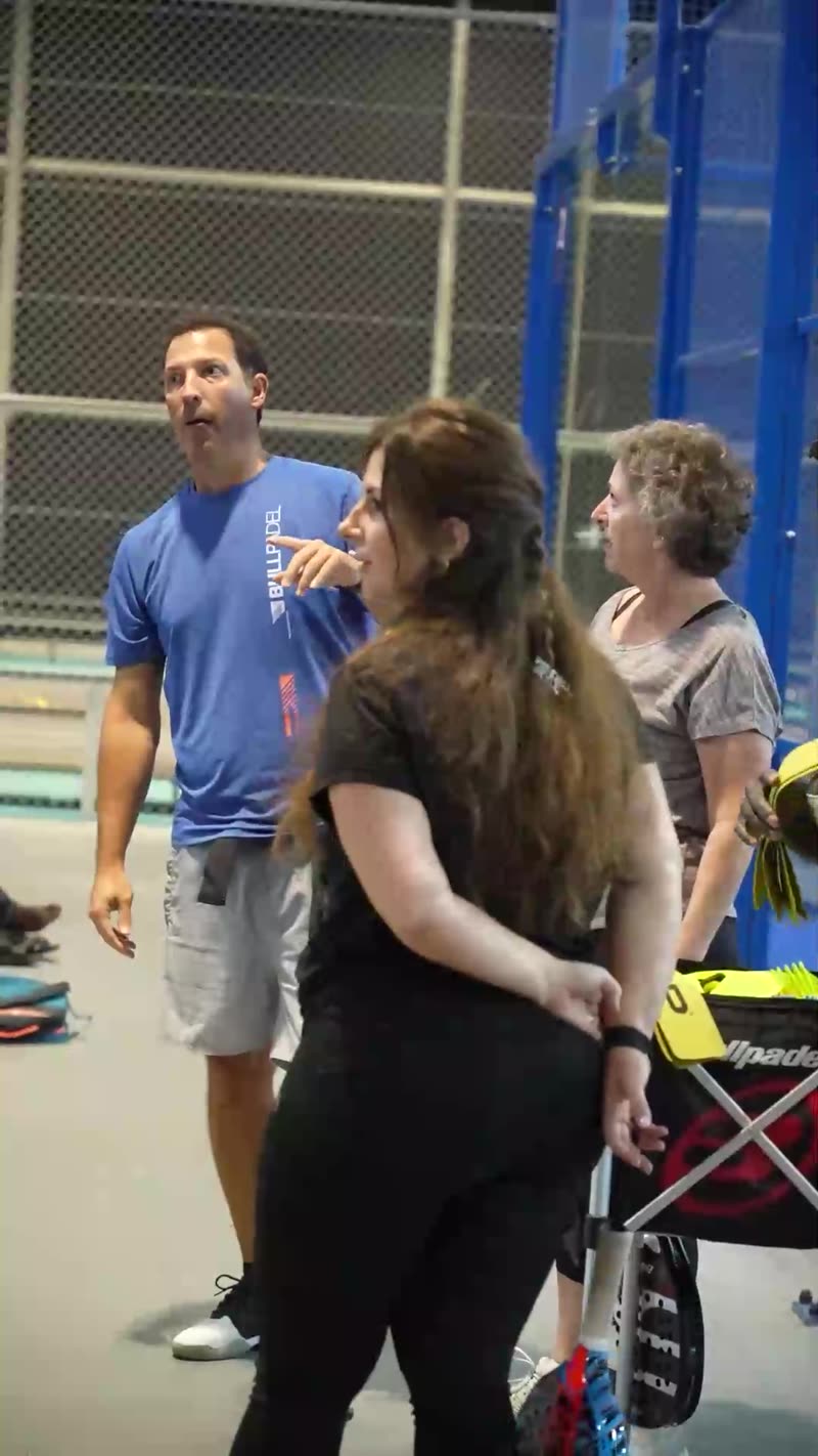 Carlos Ferretti talking with students in a group class